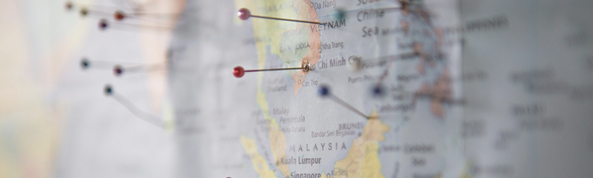 Close-up of a world map focused on Southeast Asia with location markers, symbolizing global market presence